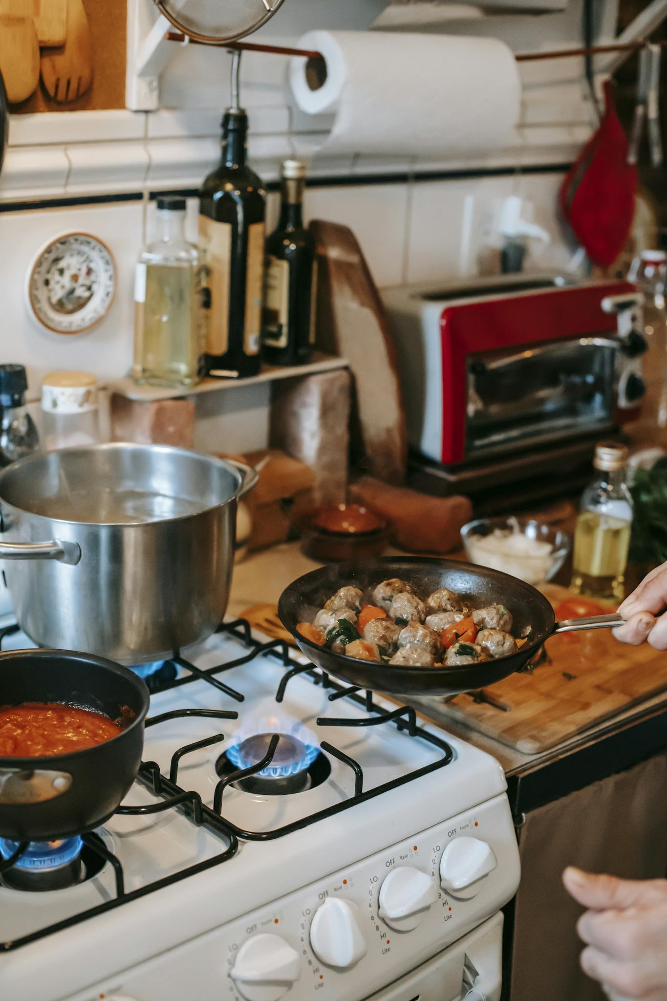 Crop person preparing lunch in house kitchen